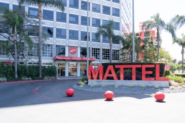 Roundabout in front of Mattel headquarters in El Segundo, California; three red balls sit outside the building, in front of "Mattel" written in big red letters.