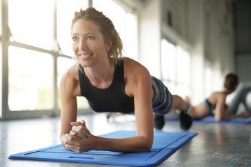 Woman doing plank in studio