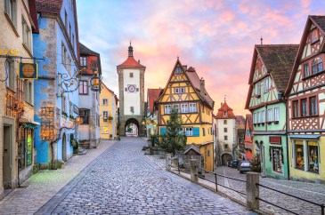 Colorful half-timbered houses in Germany; the sun seems to be setting.