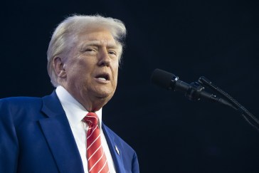 President-elect Donald Trump speaking into a microphone.