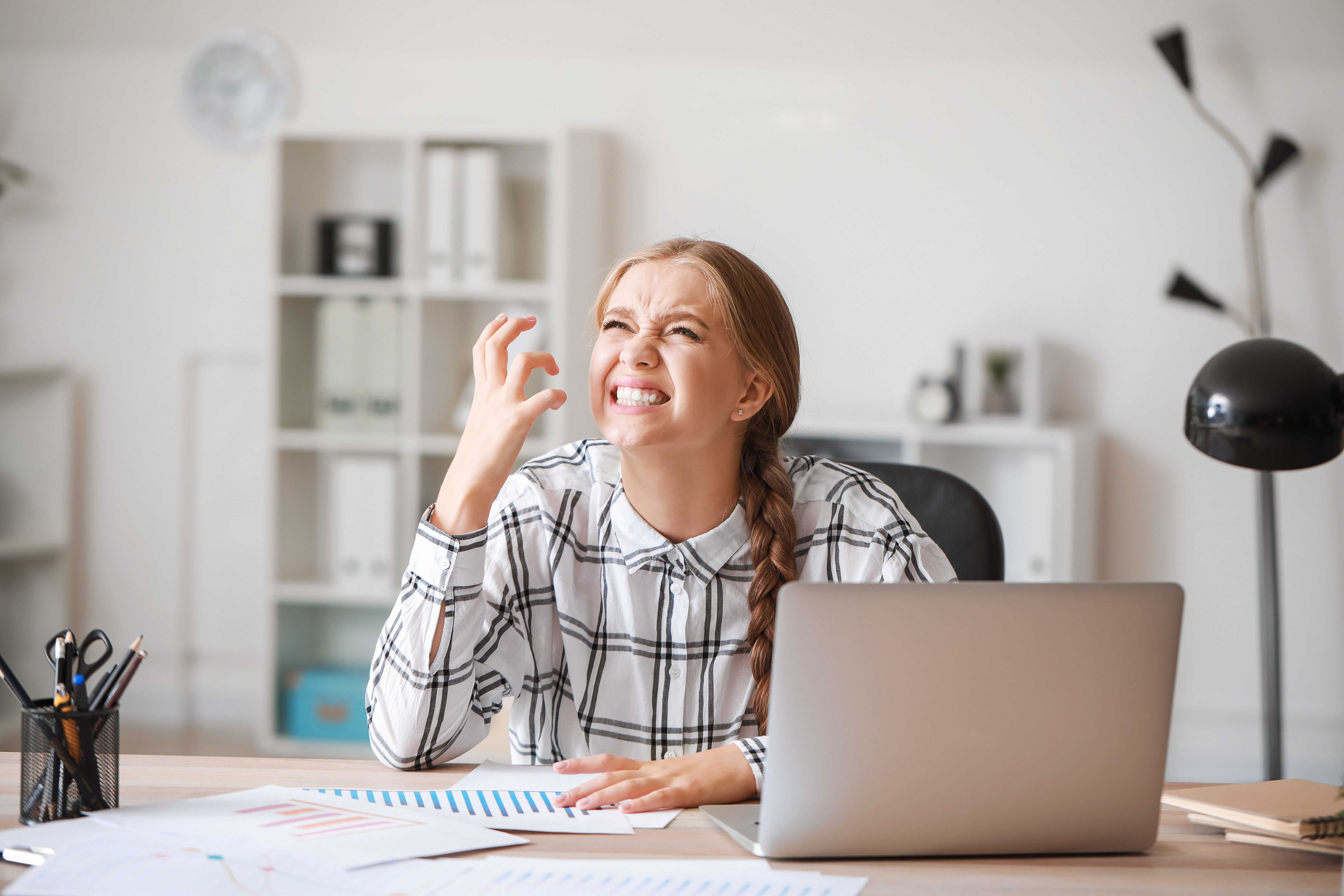 Woman frustrated while sitting in front of a computer