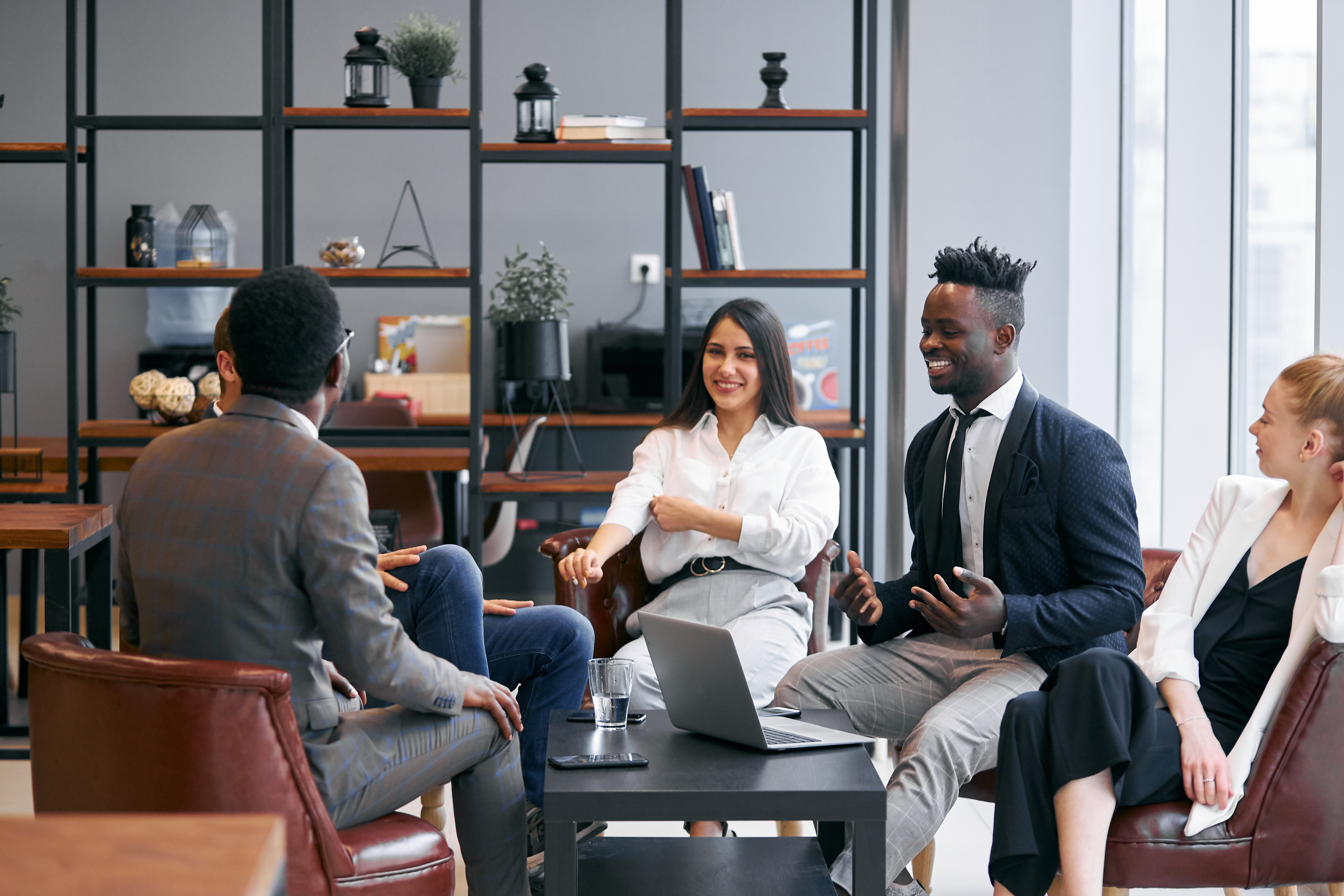 Group of employees sitting together talking