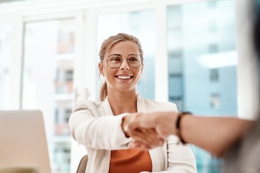 Young woman shaking hands