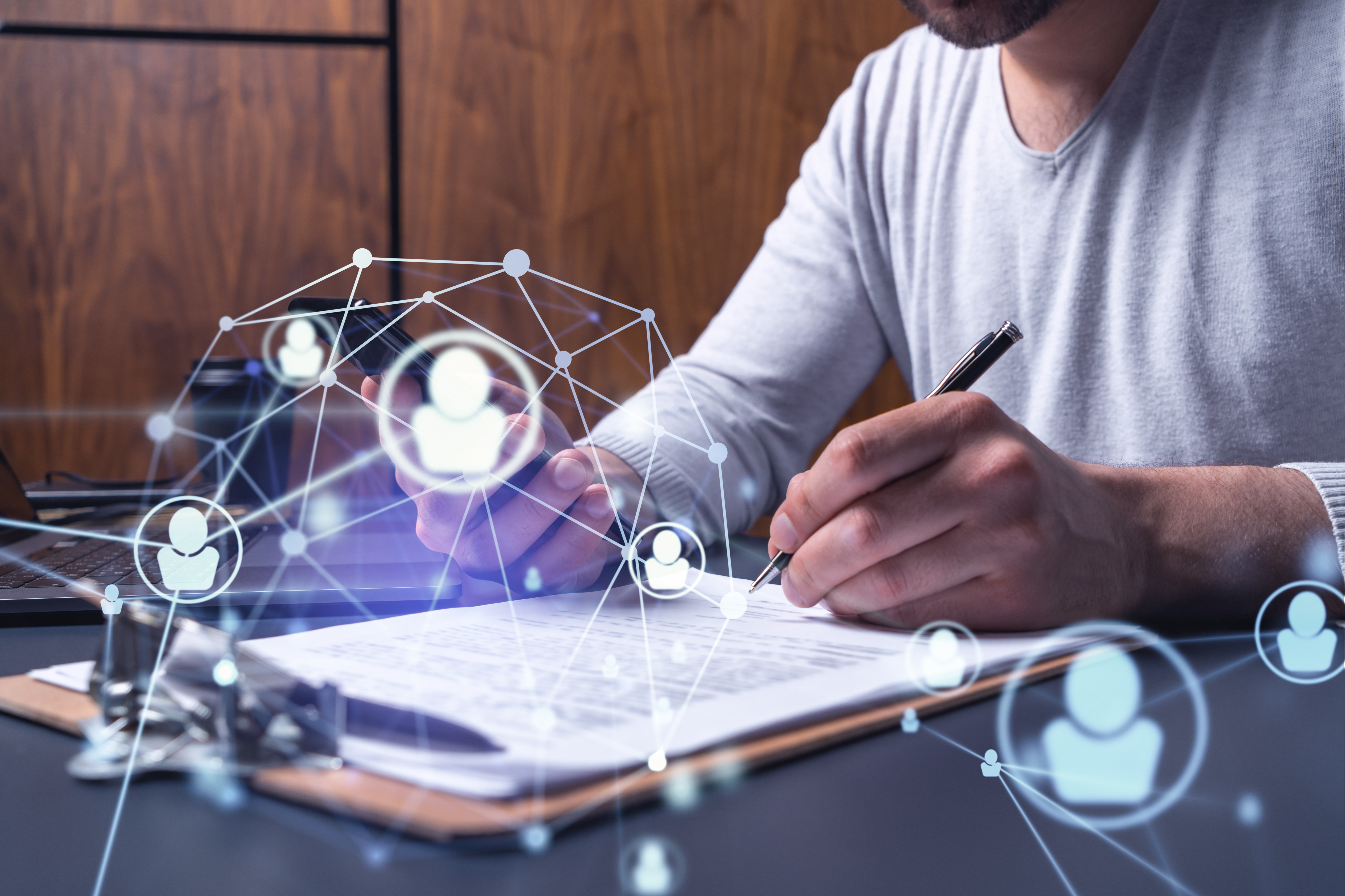 A man is making notes on a document.