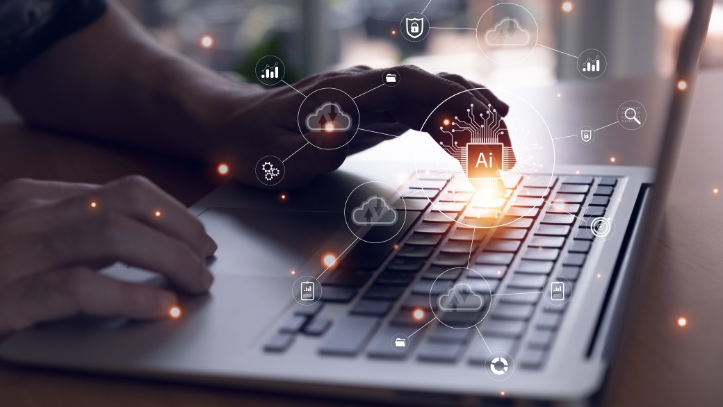 Man typing on computer with AI and tech icons