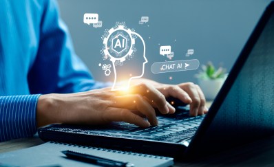 Woman typing on a computer with AI symbols