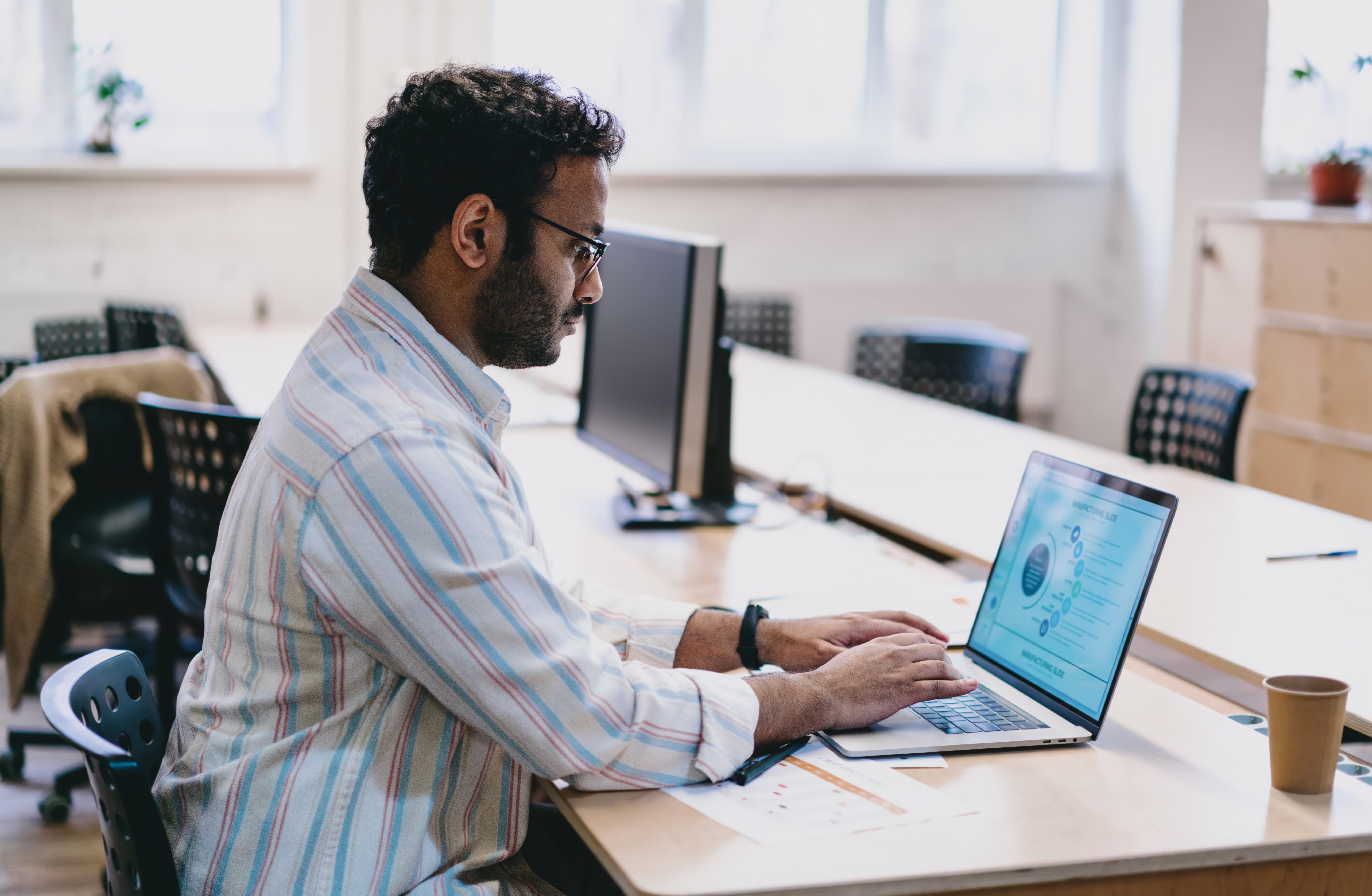 IT person typing on a computer
