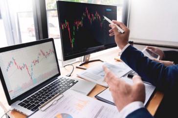 Business leader looking at economic data