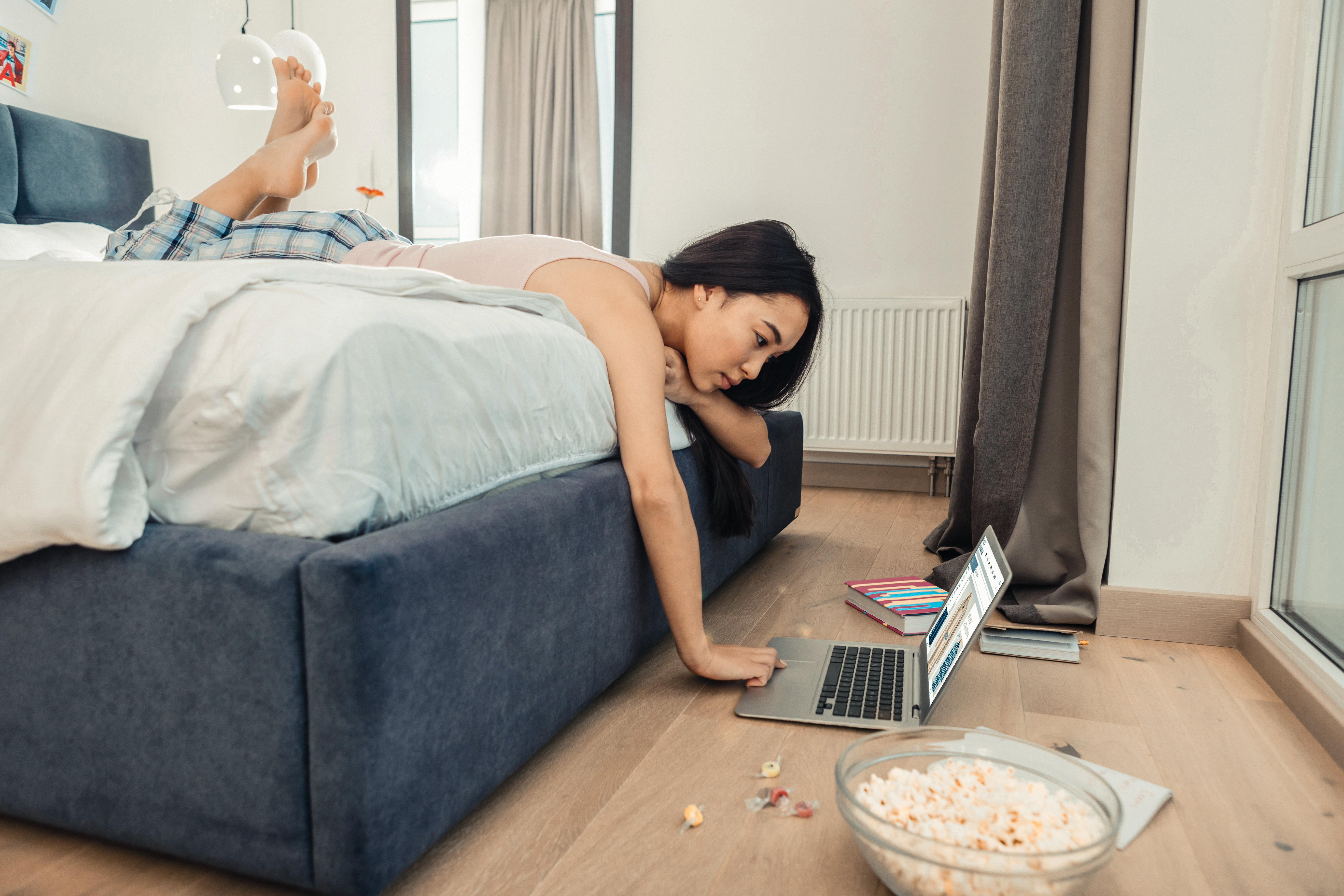 Woman working in her bed