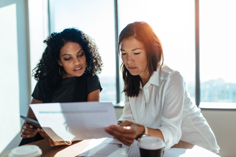Two women looking over paperwork