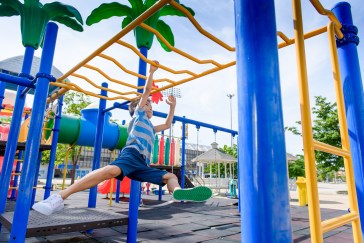 A little boy playing on the playground