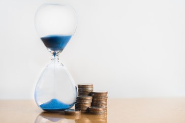 Countdown clock next to piles of money