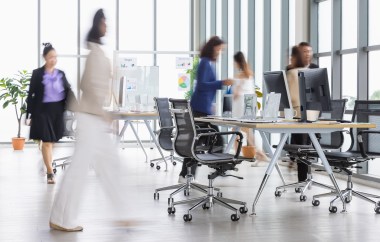 People walking around an office