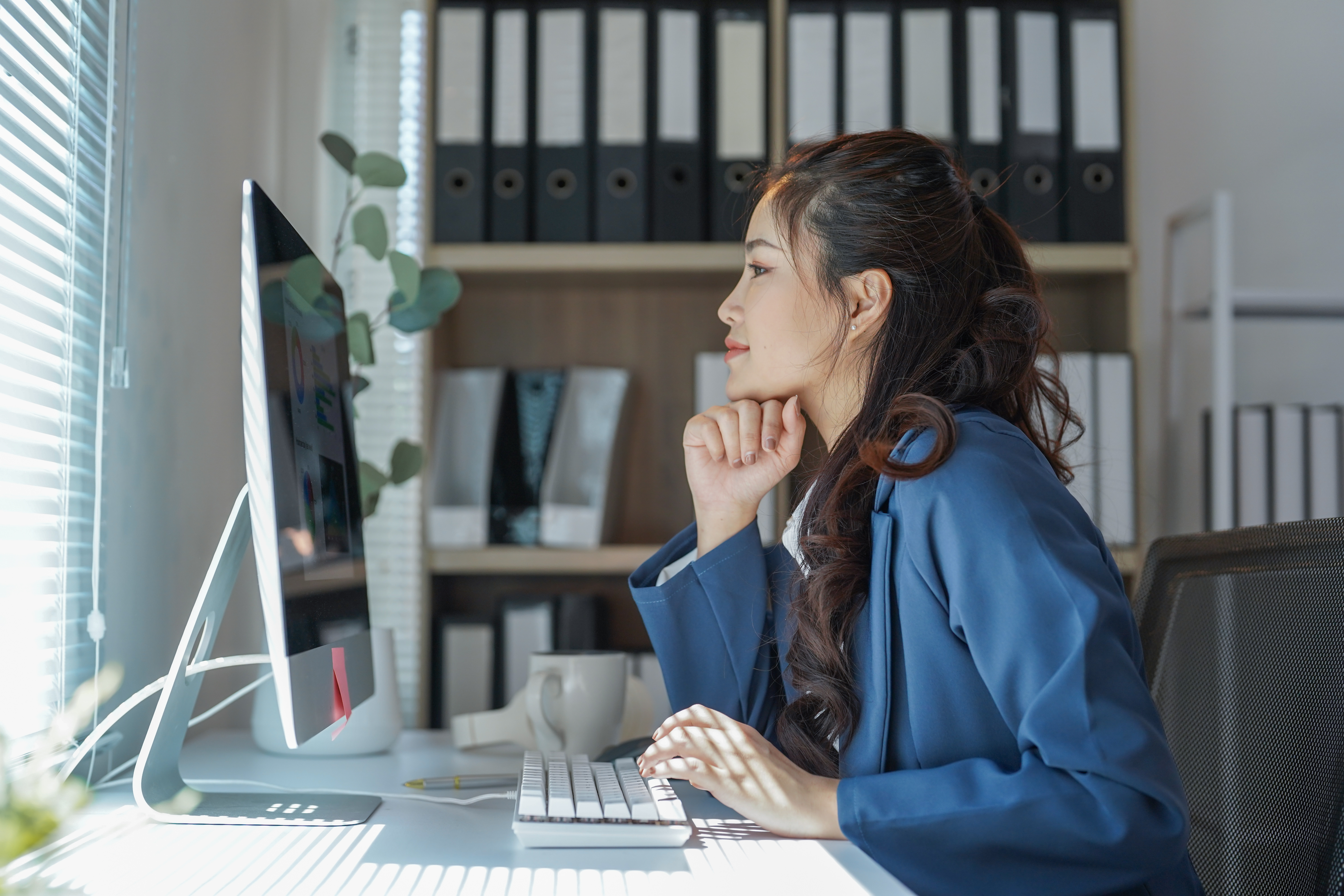 Woman typing on computer