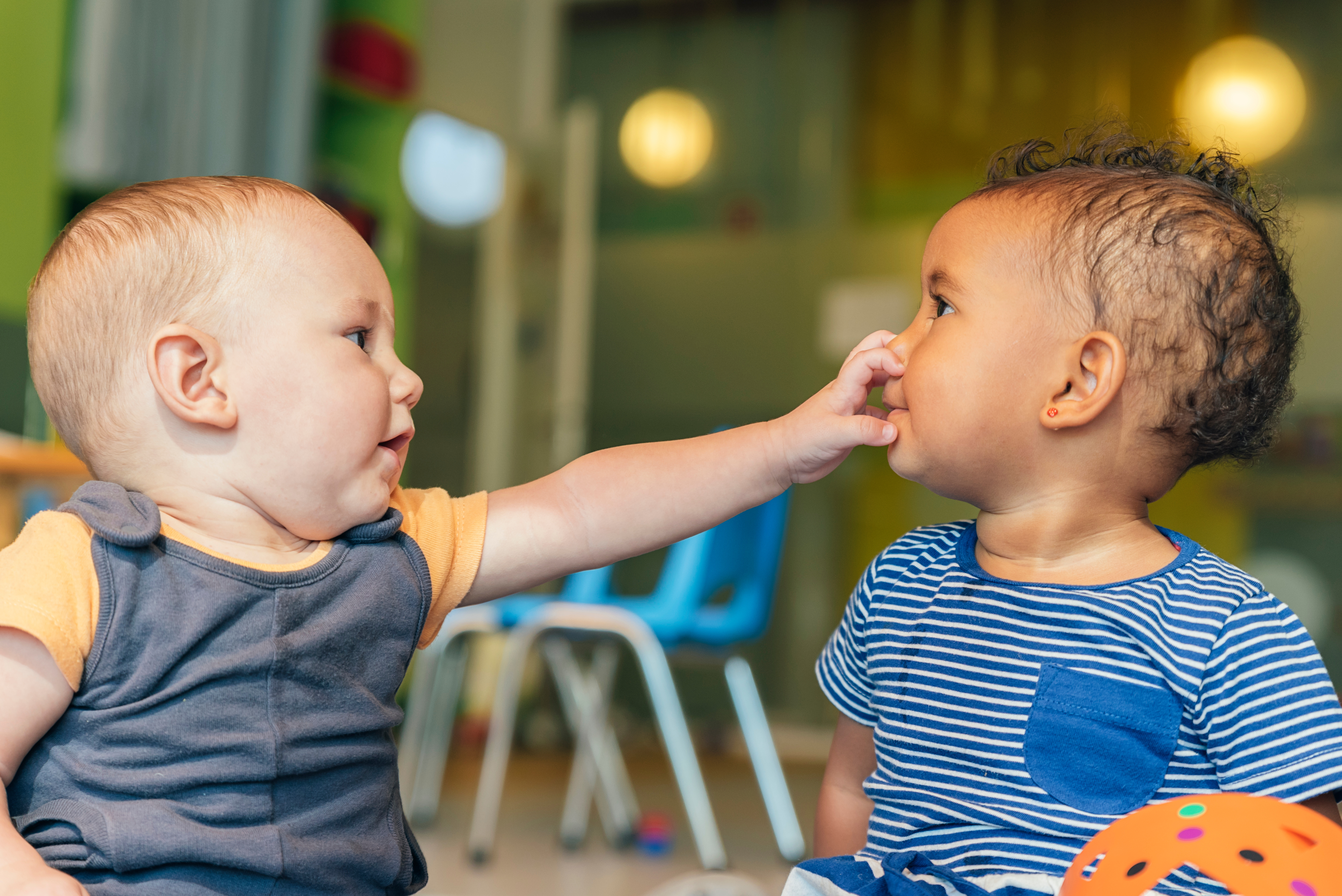 Two babies playing together