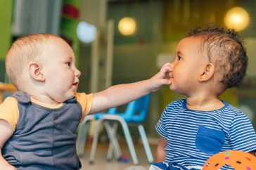 Two babies playing together