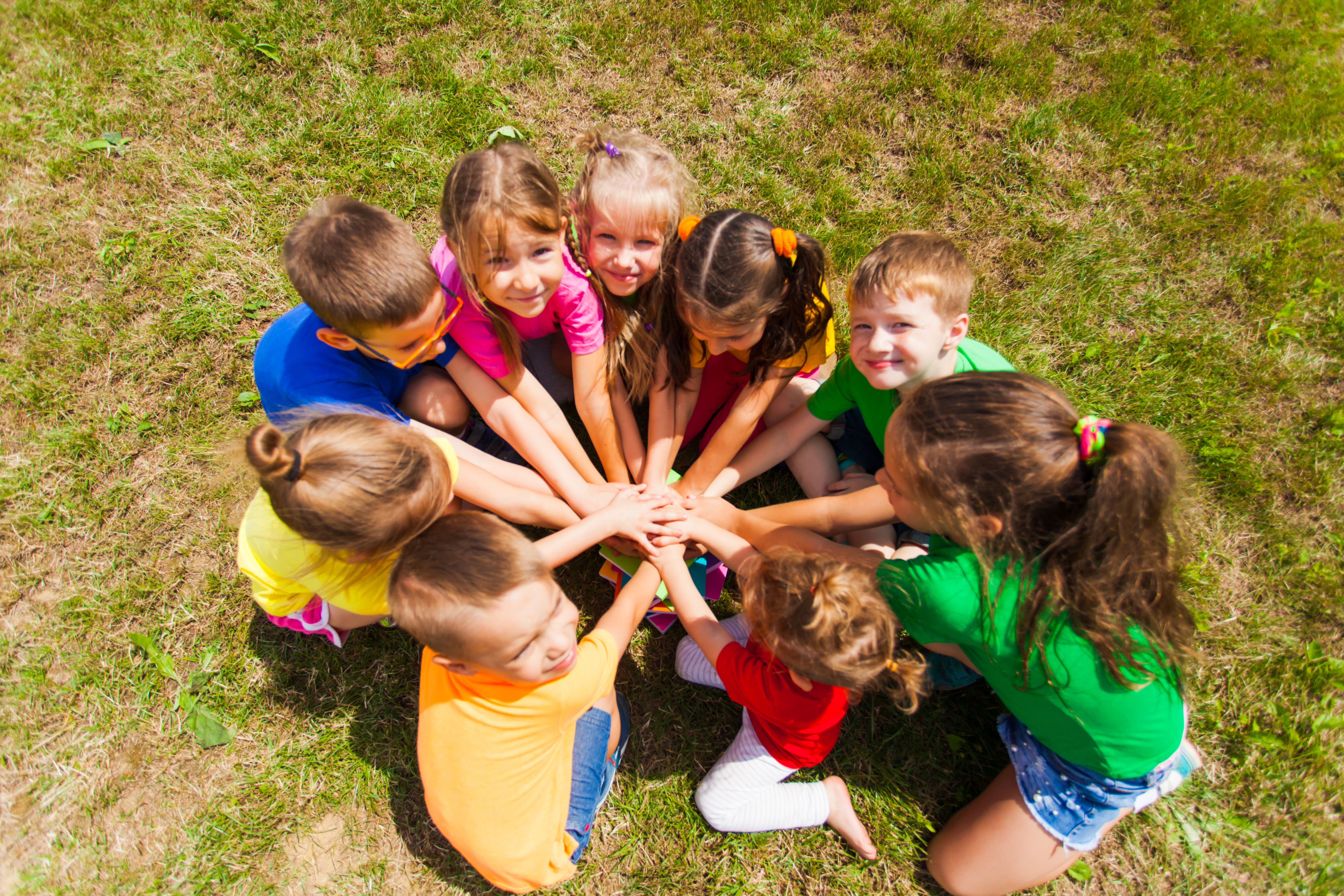 Group of kids with hands connected