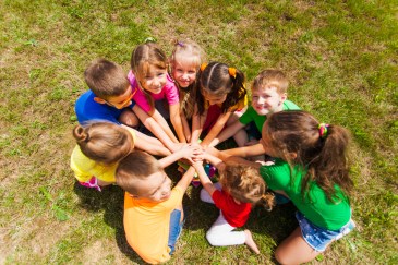 Group of kids with hands connected