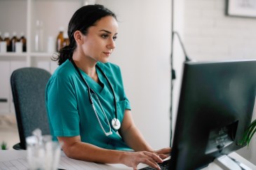 Healthcare professional on computer