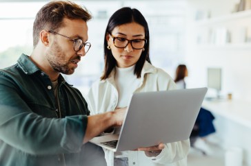 People looking at laptop