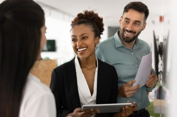 Employees talking and smiling