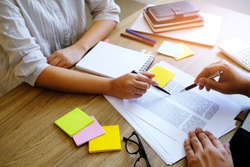 Two employees working together on a project