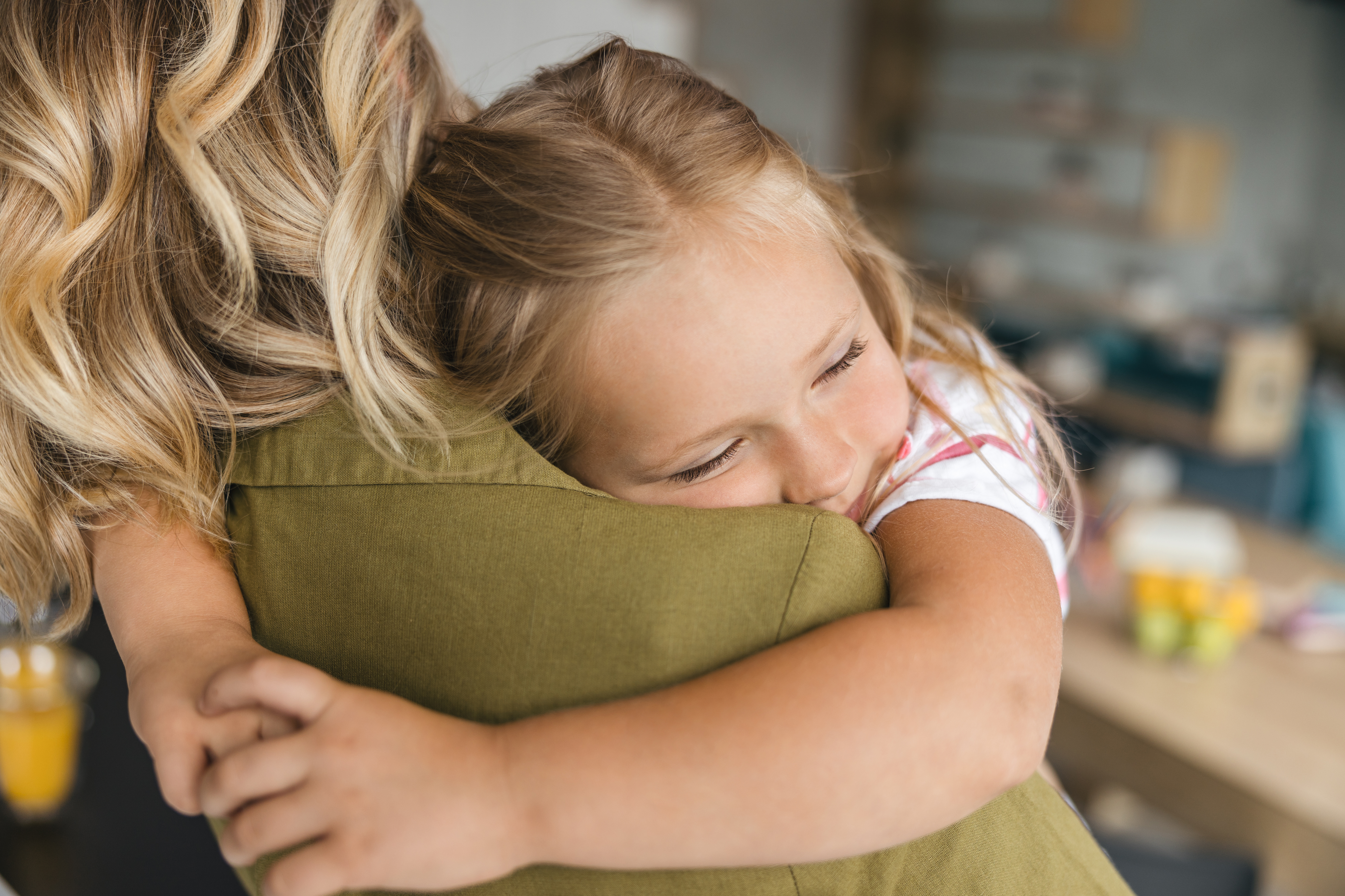 Little girl hugging her mom