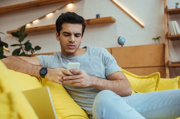 Man texting on his phone