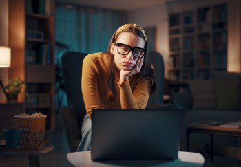Woman alone at her computer