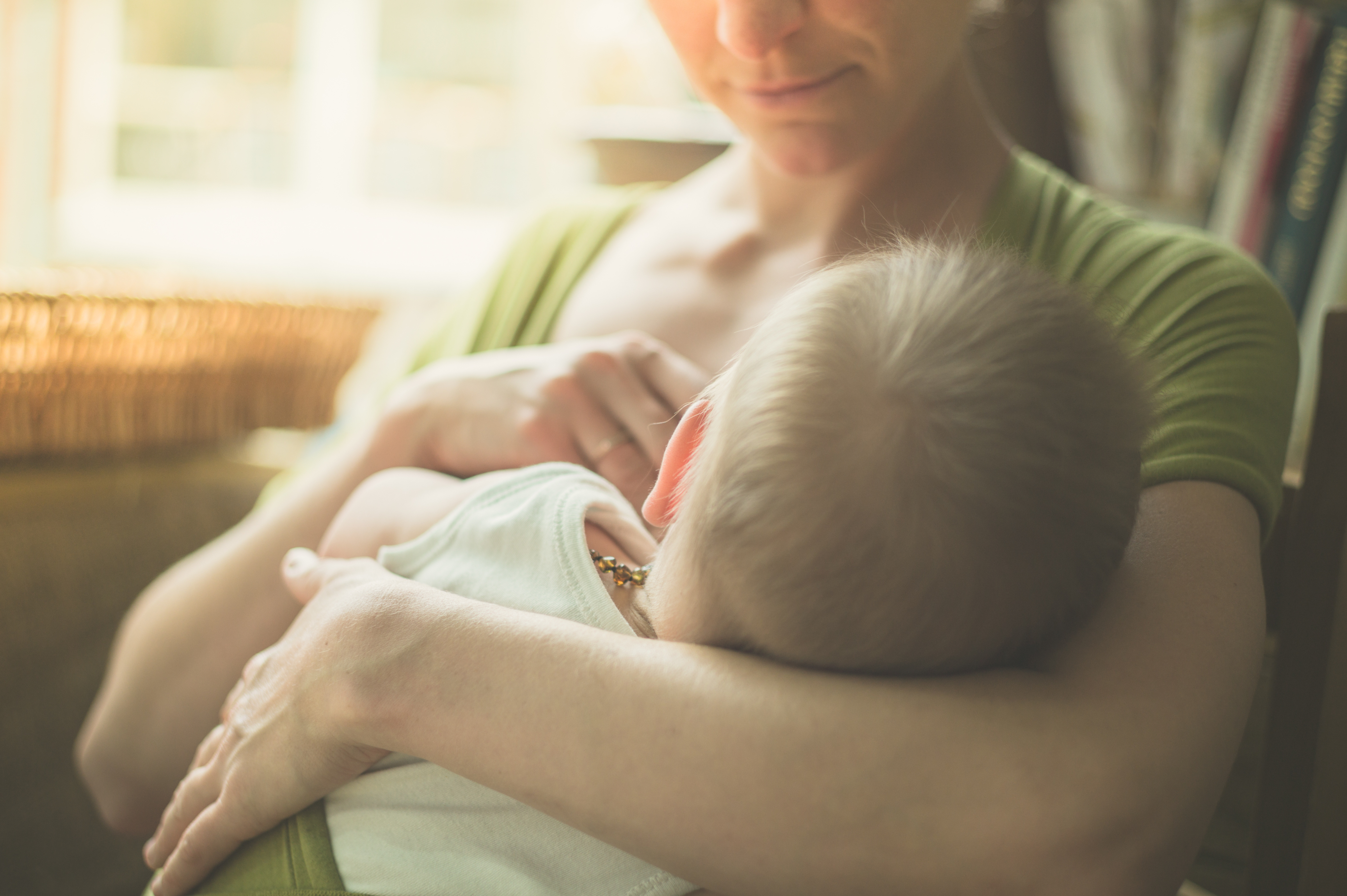 Woman and child breastfeeding