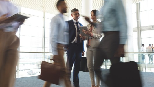 Business people walking around
