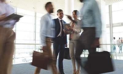 Business people walking around