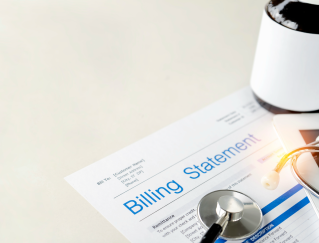 Medical stethoscope on top of a billing statement