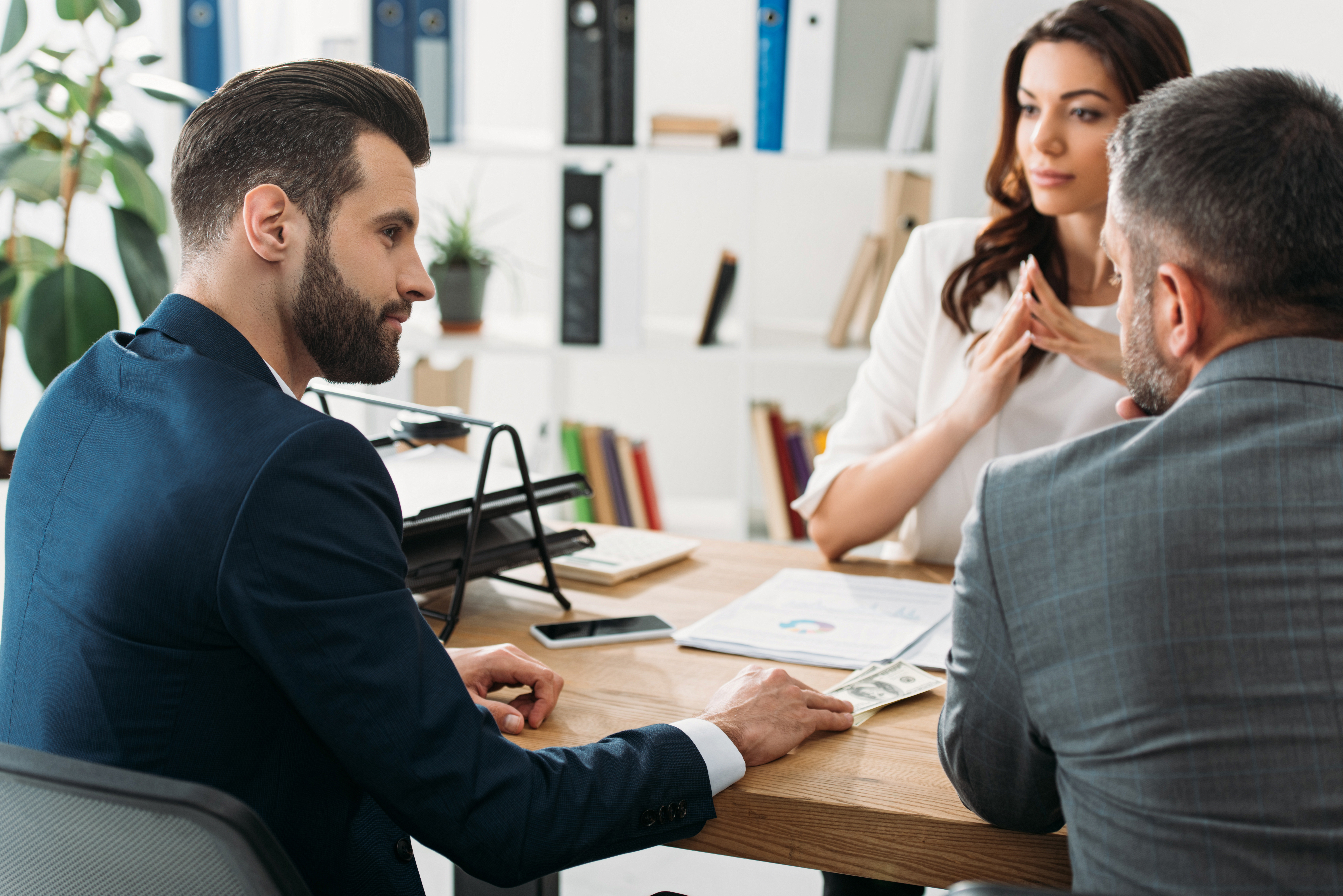 Advisers meeting with a client