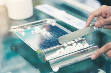 Pharmacist sorting pills