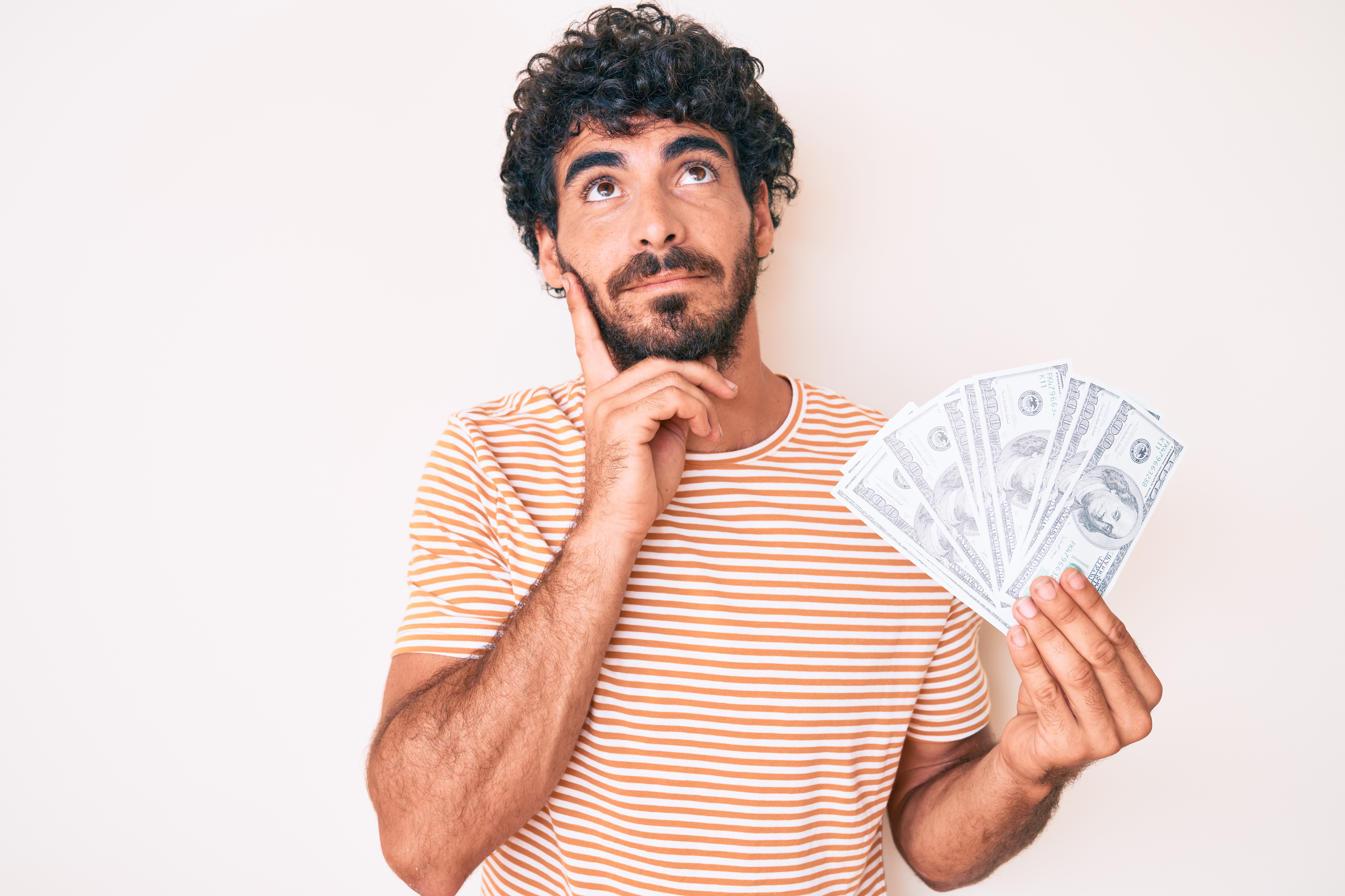 Man thinking about what to do with money