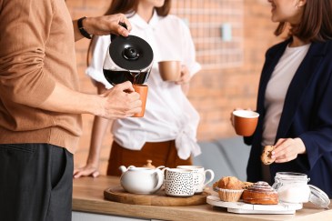 Coworkers drinking coffee together