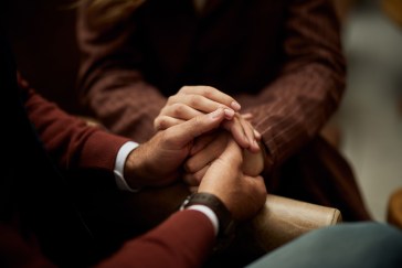 A man and woman holding hands.