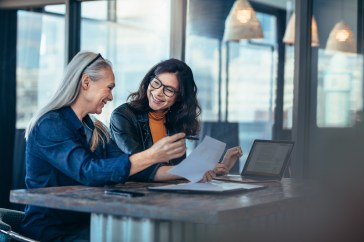 Two female employees talking