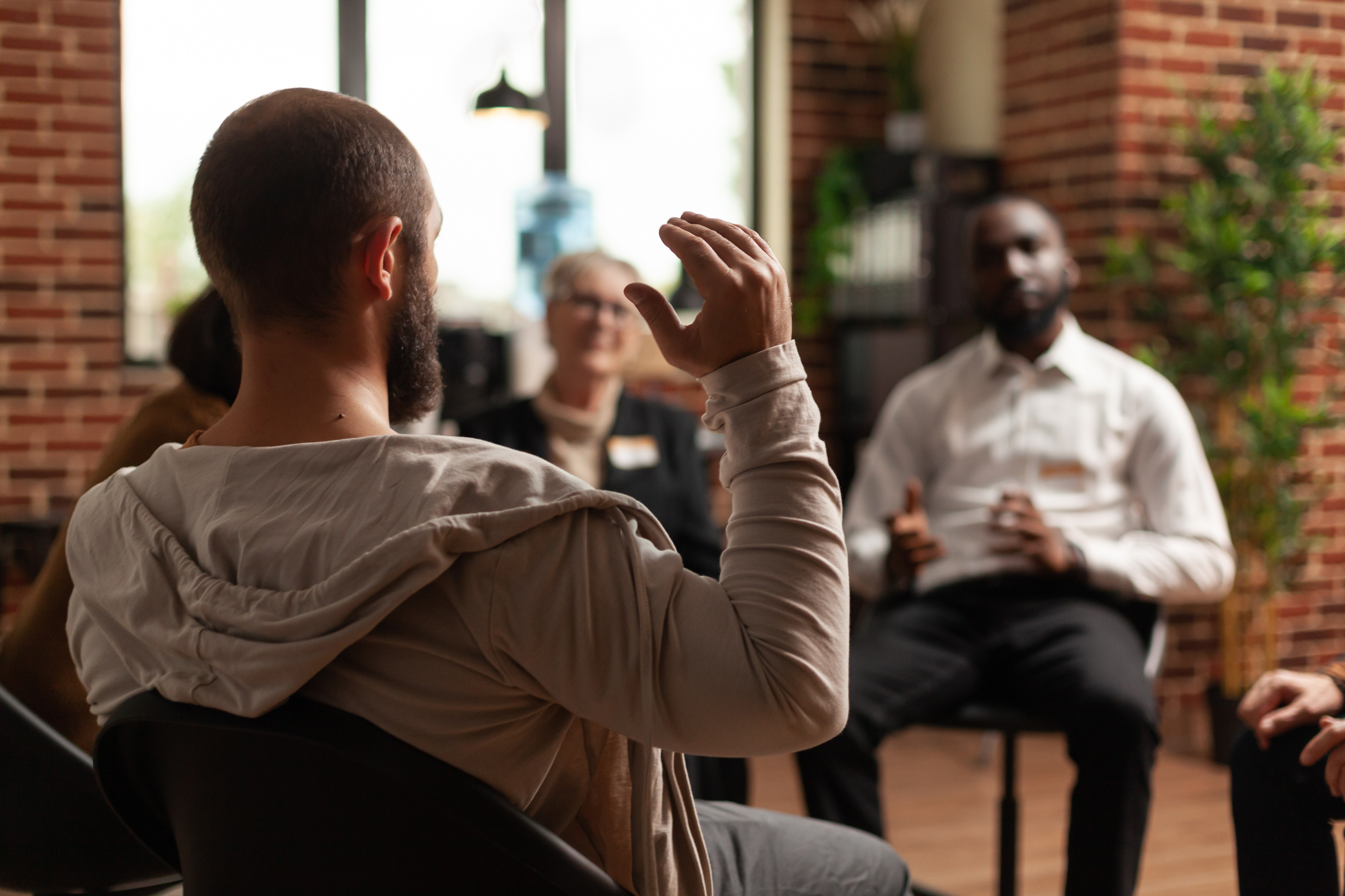 A man sharing a story at a group meeting.