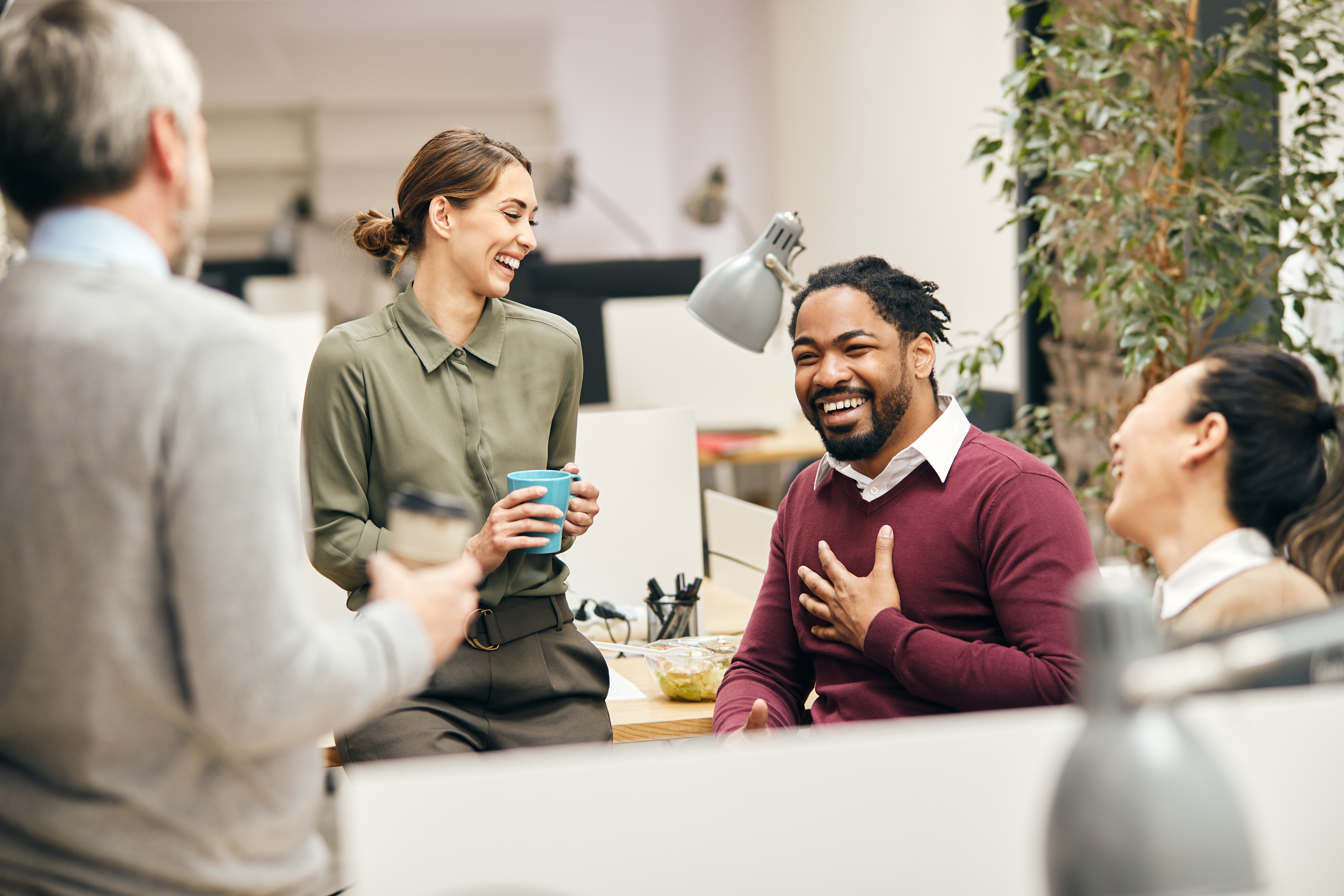 Employees having fun in office, laughing