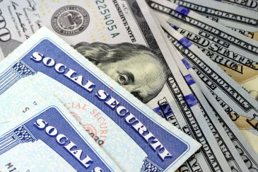 Social security cards and one hundred dollar bills.