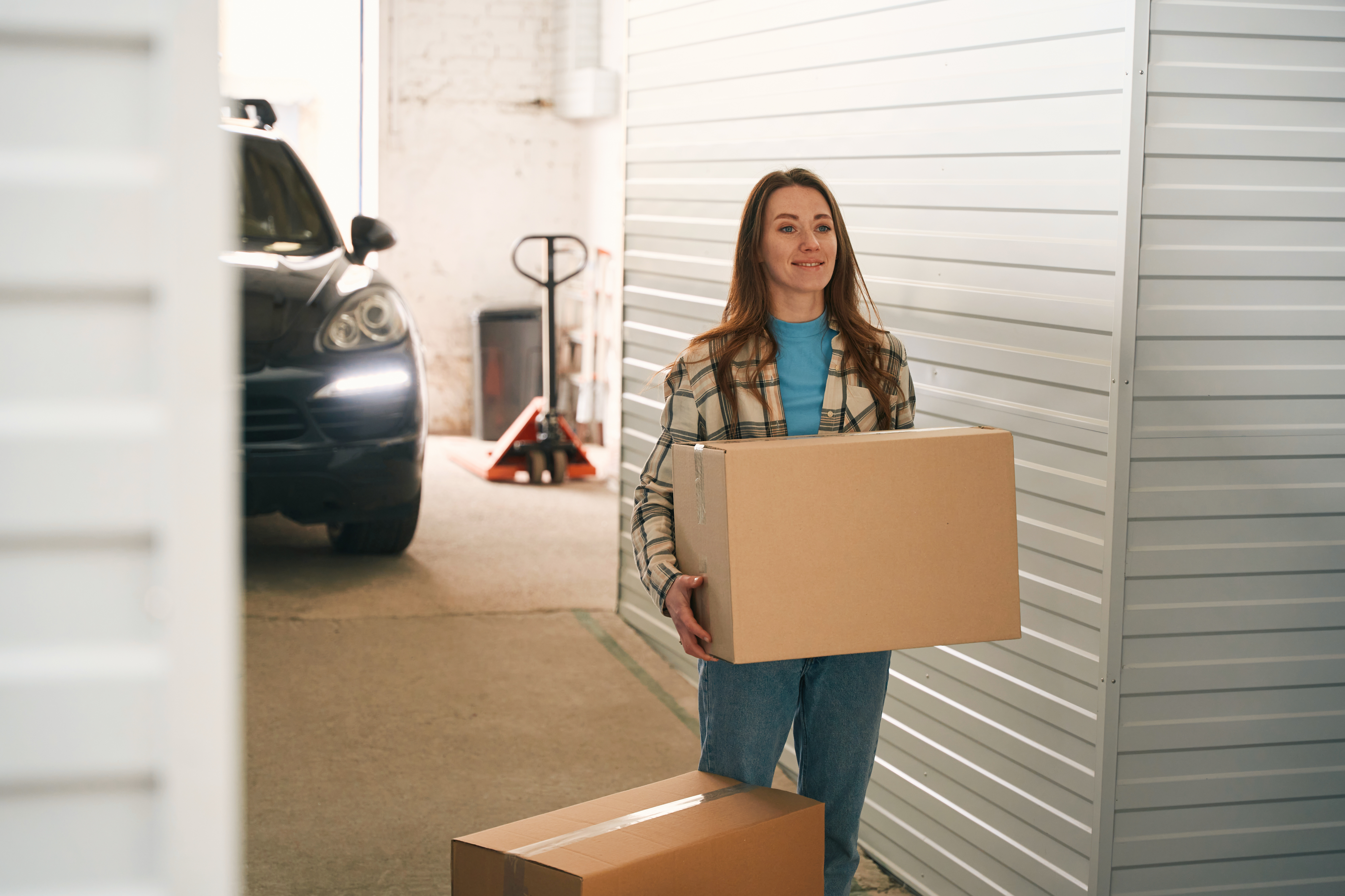 Woman holding a moving box