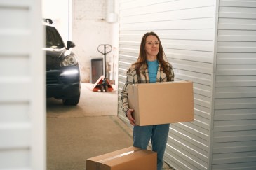 Woman holding a moving box