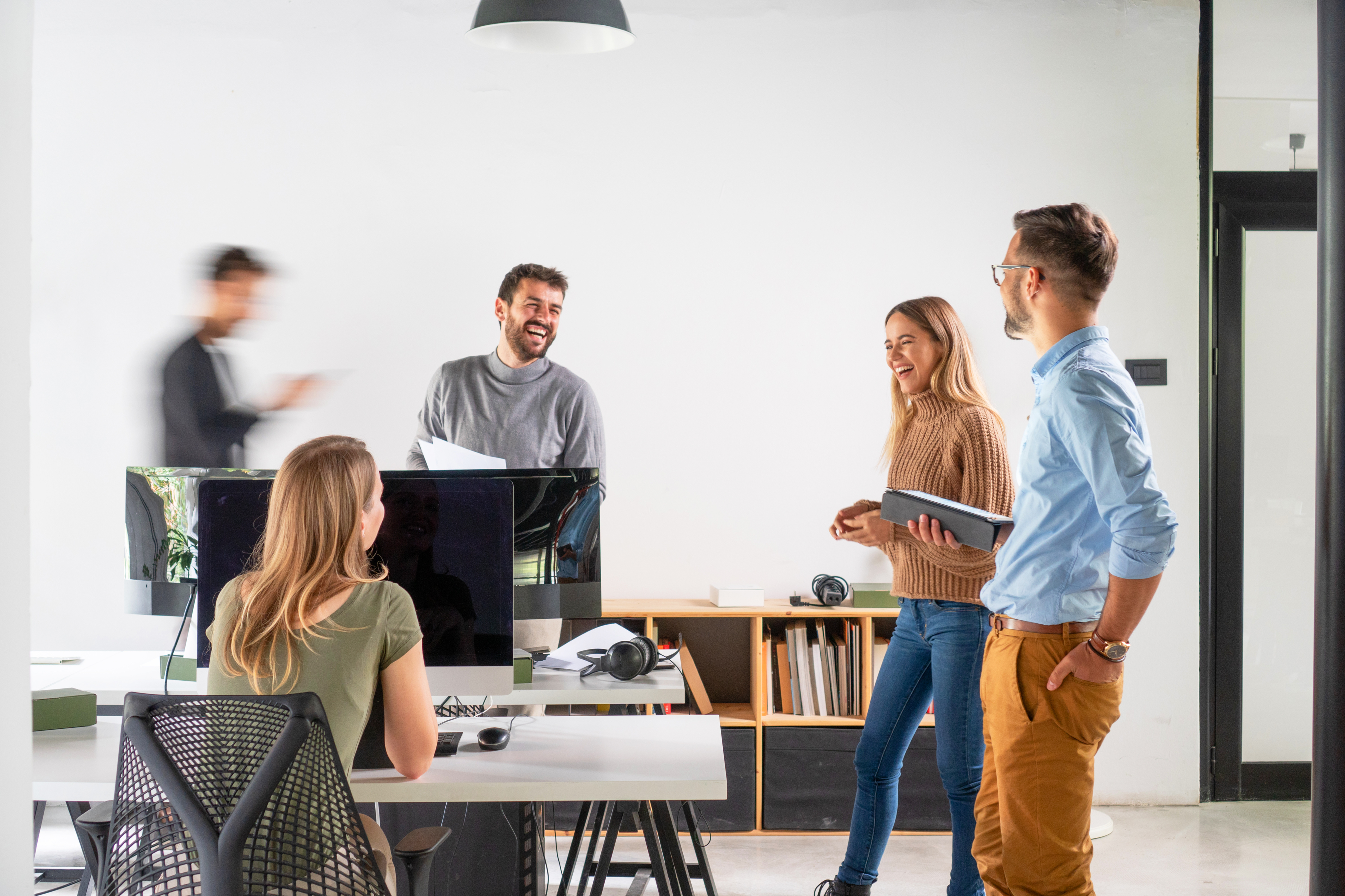 Group of employees in office, young, smiling