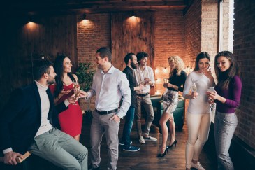 Office gathering, people standing, talking