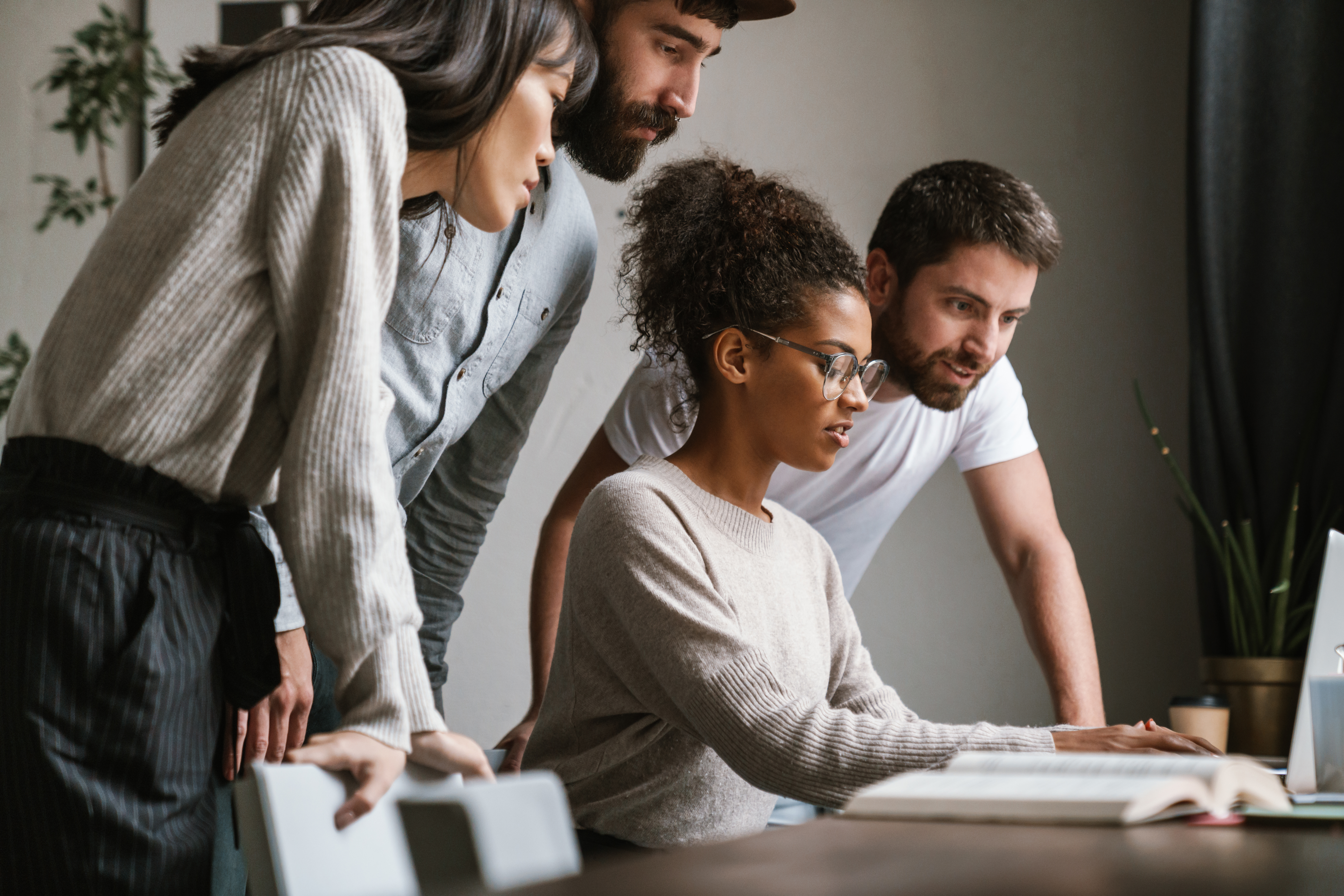 Young employees choosing their benefits together
