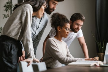 Young employees choosing their benefits together