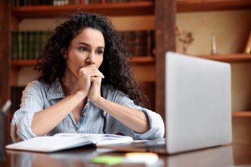 Woman concerned at her computer