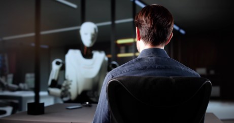Job candidate being interviewed by a robot